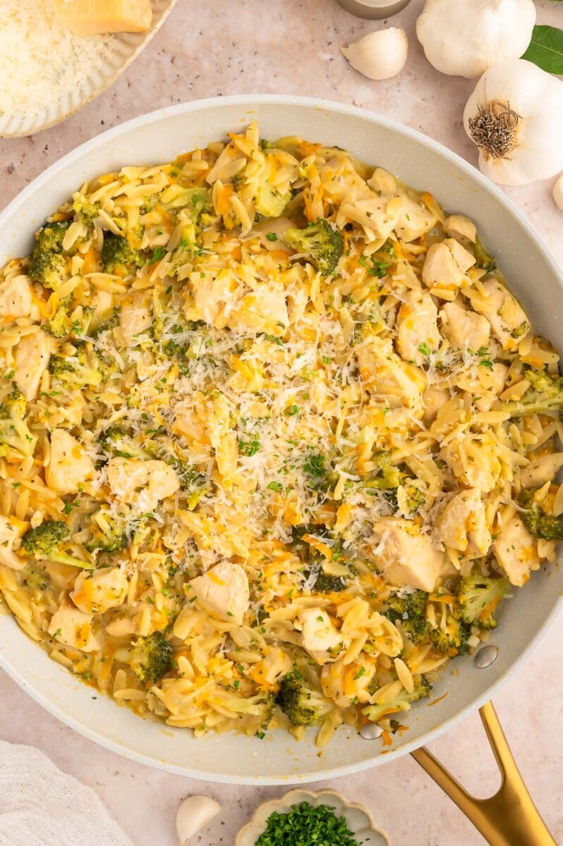 Broccoli Cheddar Chicken Orzo in a pan.