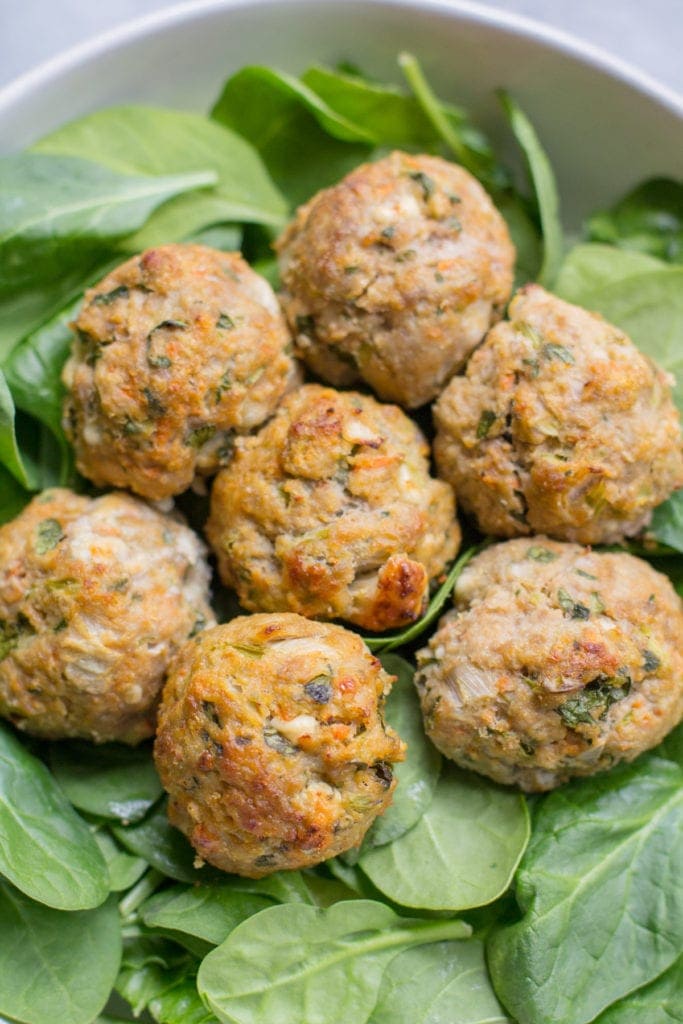 Buffalo Turkey meatballs over a bed of spinach