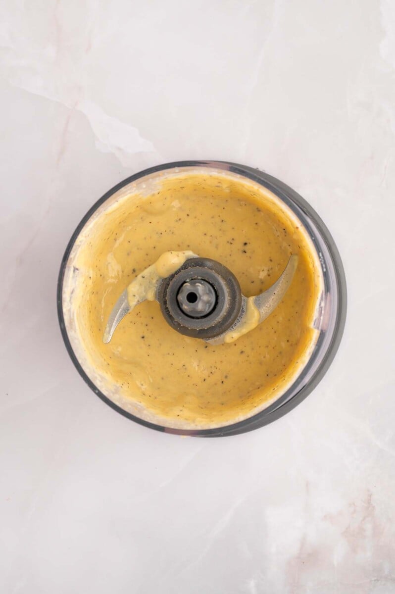 Caesar salad dressing blended in a small food processor. 