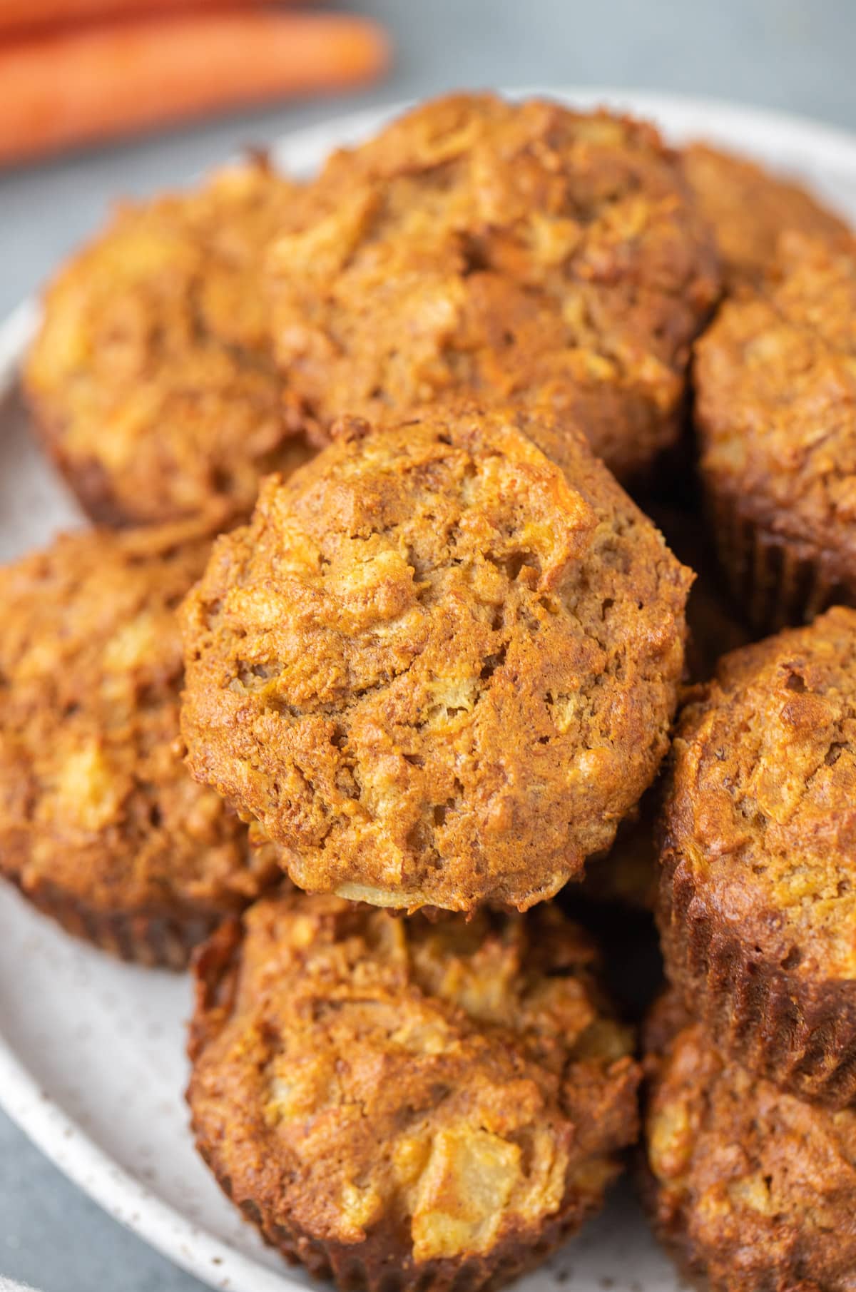 A white plate filled with healthy carrot muffins