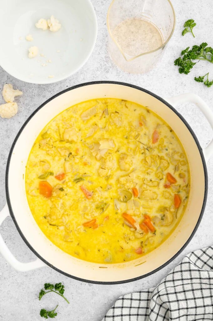 All ingredients for cauliflower soup (except milk and cheese) in a stock pot after cooking