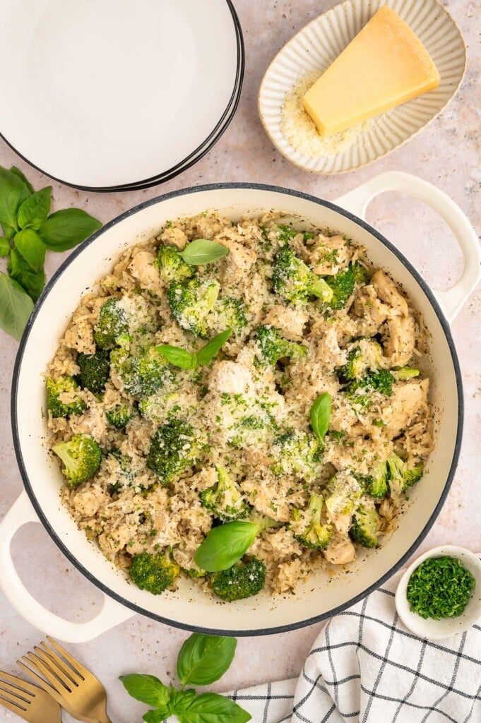 An overhead shot of chicken and broccoli rice in a dutch oven.