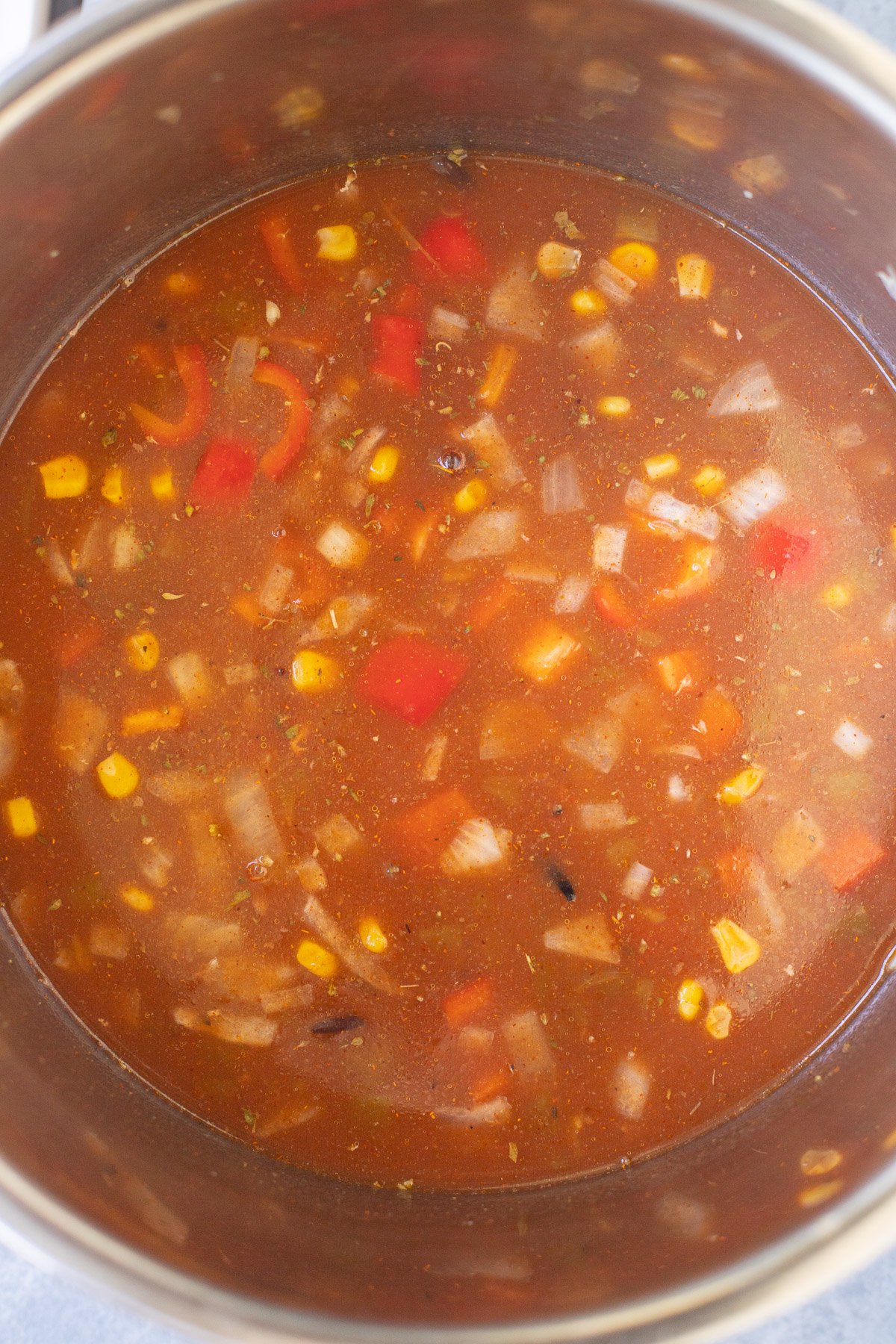 chicken enchilada soup in the instant pot before being cooked