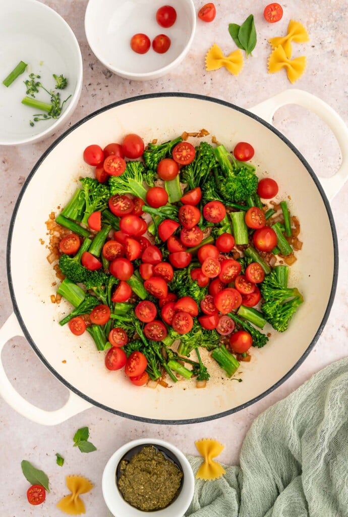 Broccolini and cherry tomatoes in a dutch oven. 