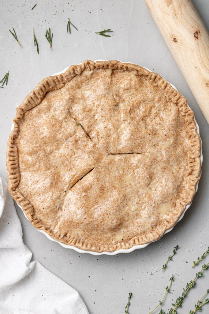 Uncooked healthy chicken pot pie on a grey background