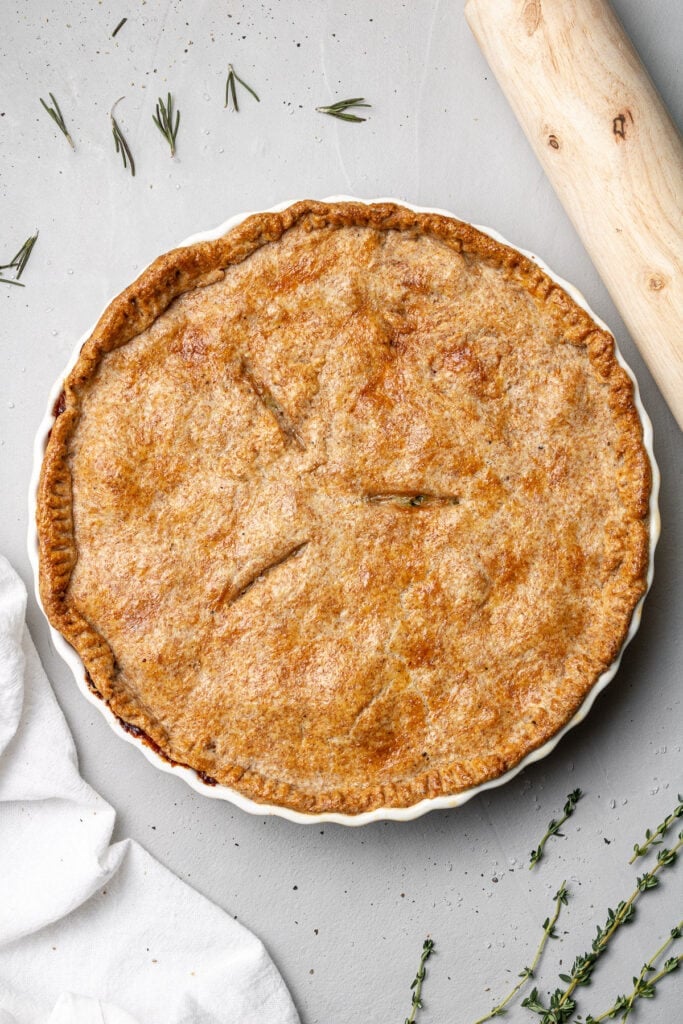 Cooked healthy chicken pot pie on a grey background