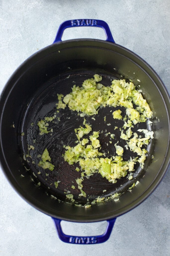 Sautéd onions, garlic, and celery in olive oil in a stock pot to make chicken vegetable soup