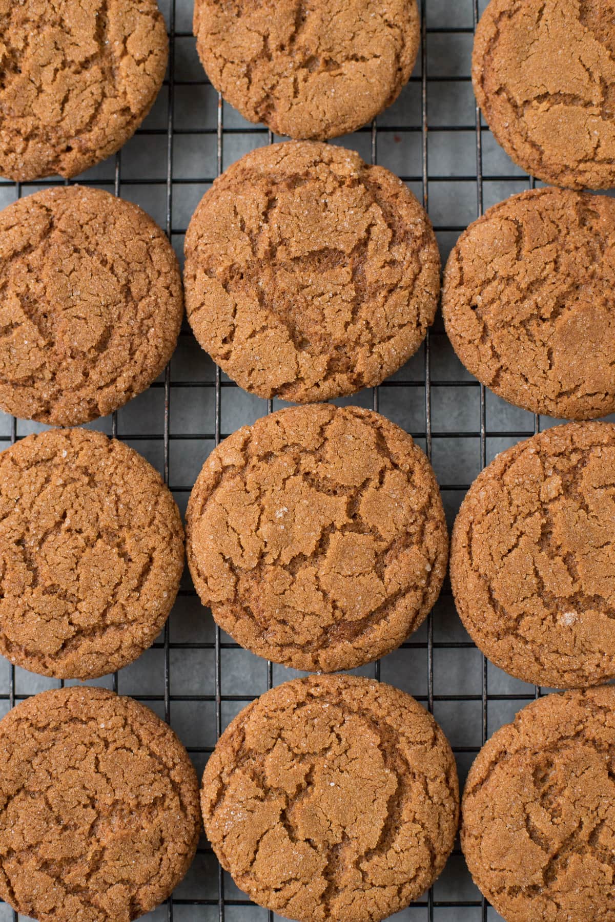A close up of The BEST Crispy Gingersnap Cookies on a cooling rack