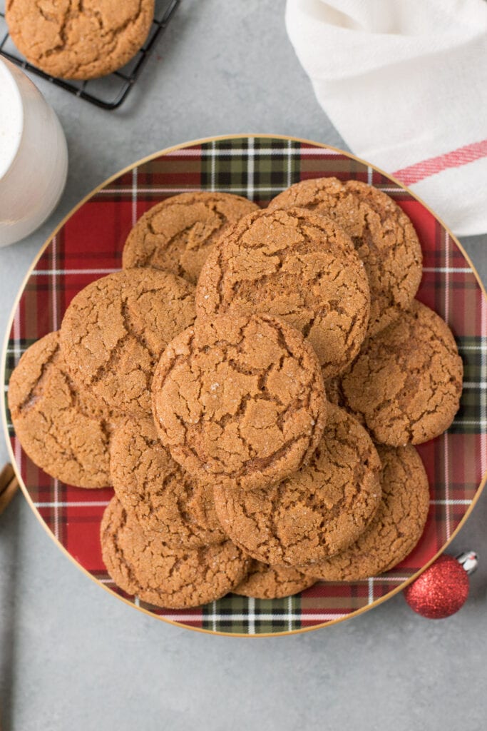 Gingersnap Cookies on a holiday plaid plate on a grey background