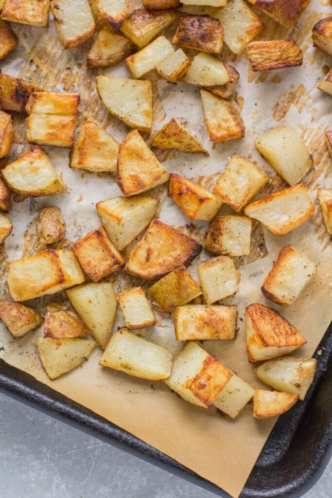 A sheet pan filled with oven roasted potatoes recipe after roasting potatoes 