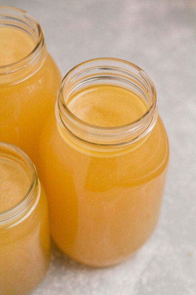 3 glass mason jars filled with slow cooker bone broth