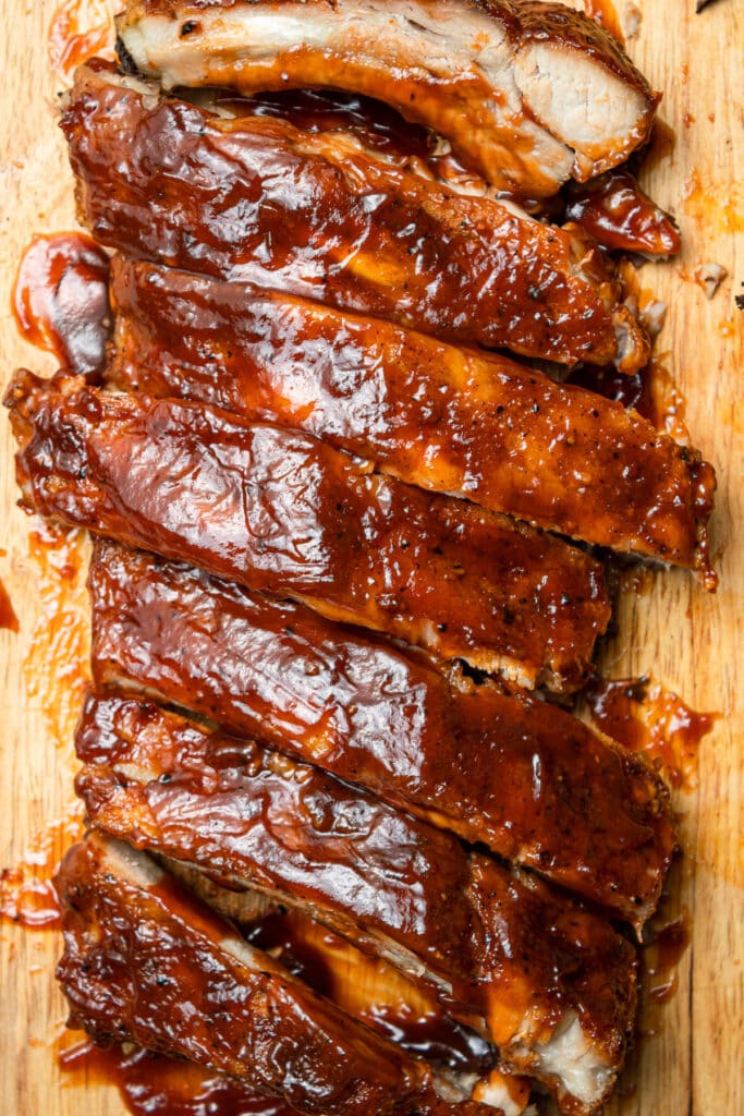 an overhead shot of crock pot baby back ribs in a row