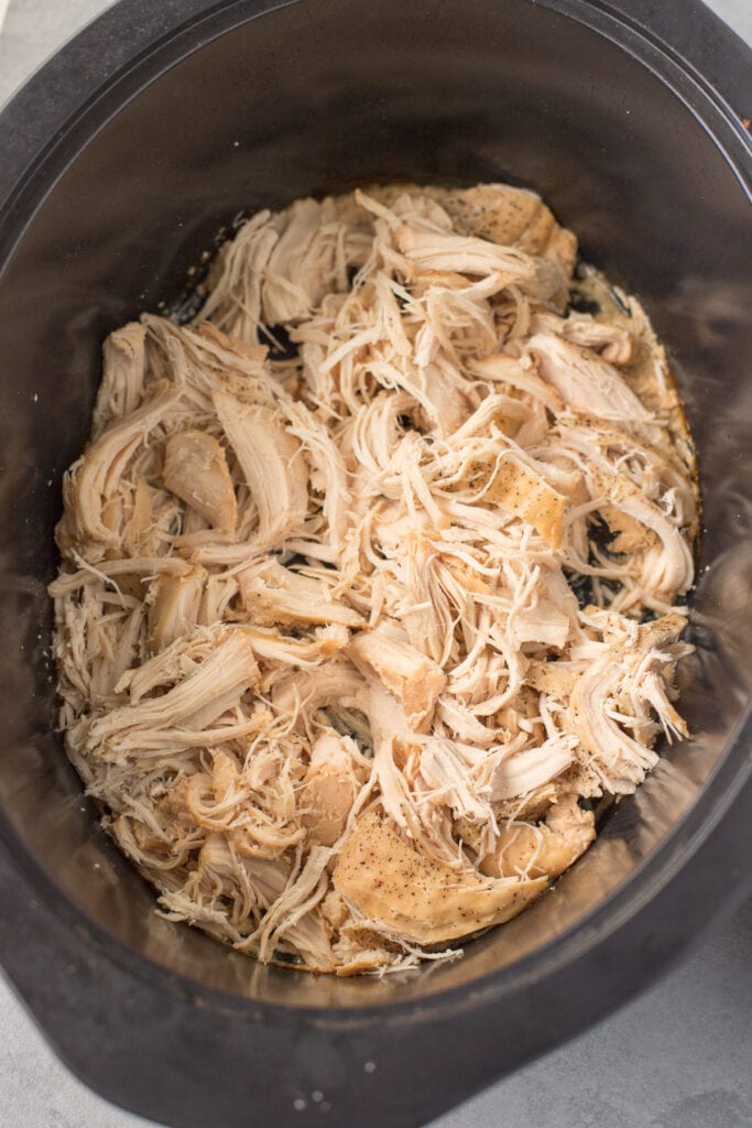 shredded chicken in black crockpot
