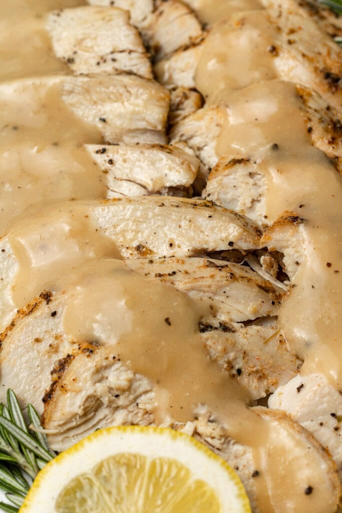 A close up of Crock pot Turkey Breast with gravy on top