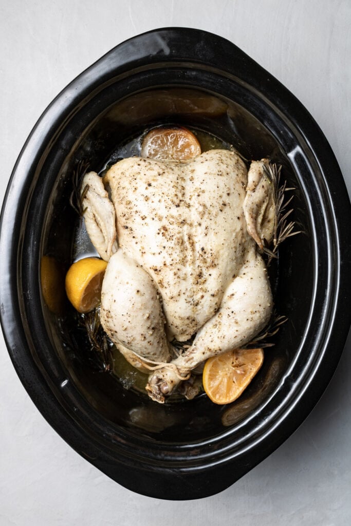 A Whole Chicken in the slow cooker after it has been cooked