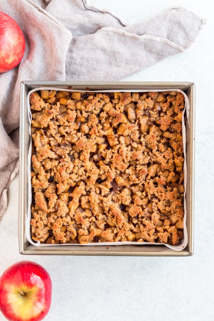 An overhead image of healthy apple crumble bars in a pan