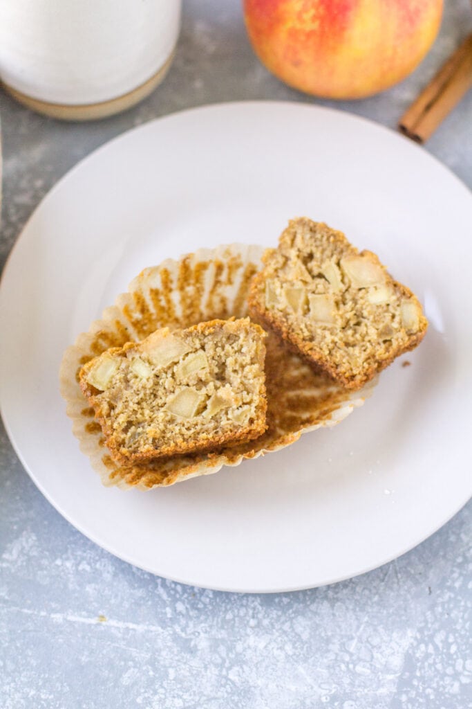 Healthy Apple muffin cut in half to show all the delicious apples inside!