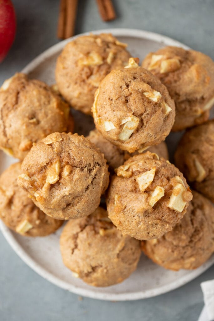 The best healthy apple muffins on a white plate on a grey background