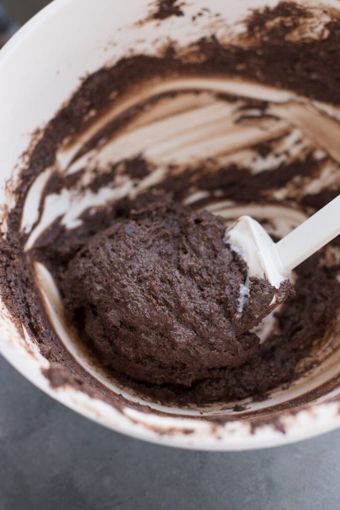 Brownie Truffle Batter in a white bowl with a spatula