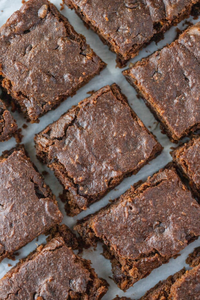 sweet potato brownies cut and placed next to each other on a grey background
