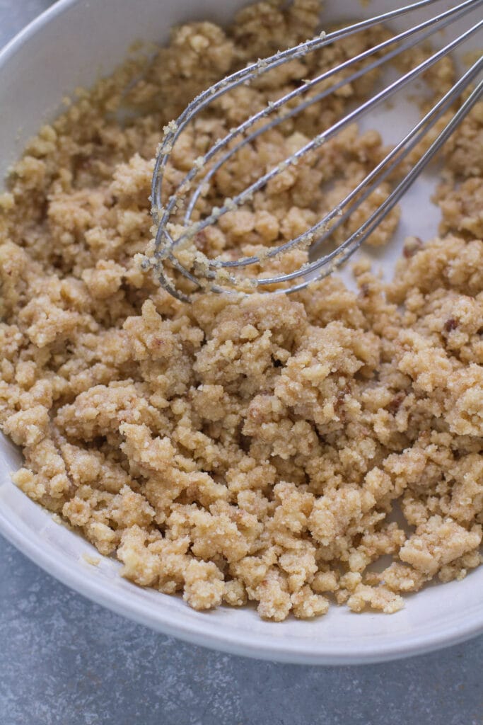 Batter for healthy cheesecake crust being mixed together