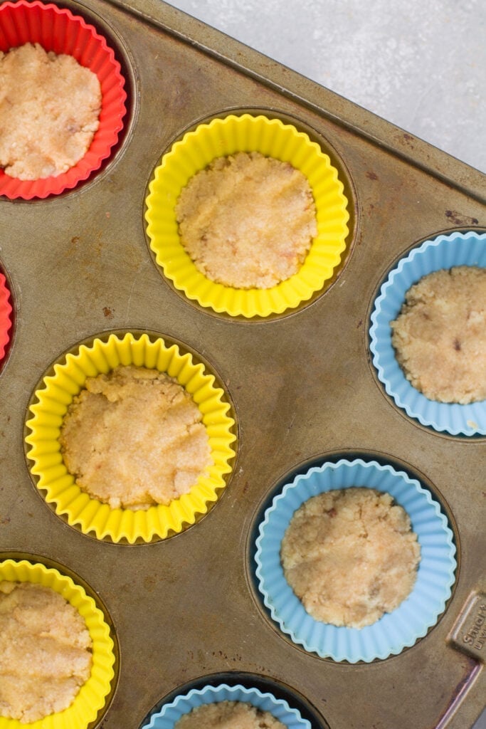 Curst for healthy cheesecakes being baked in silicone muffin liners