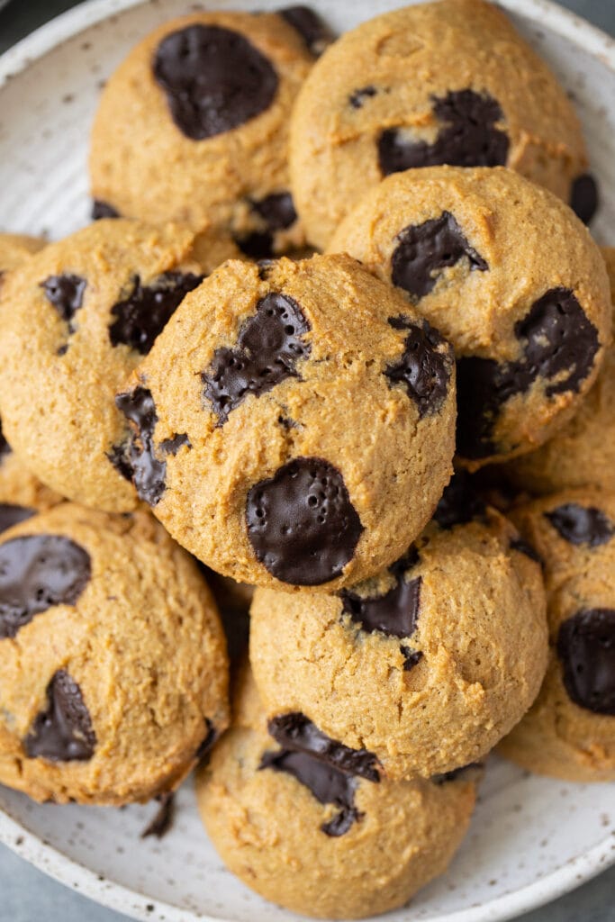 A close up of the best healthy chocolate chip cookies on a white plate