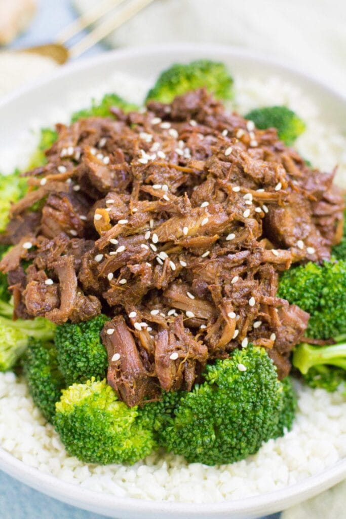 healthy slow cooker beef and broccoli made in the crockpot. overhead close up shot