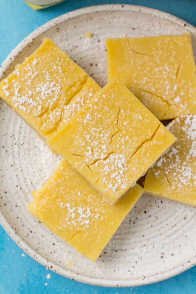 An overhead view of Gluten Free Lemon Bars on a white plate