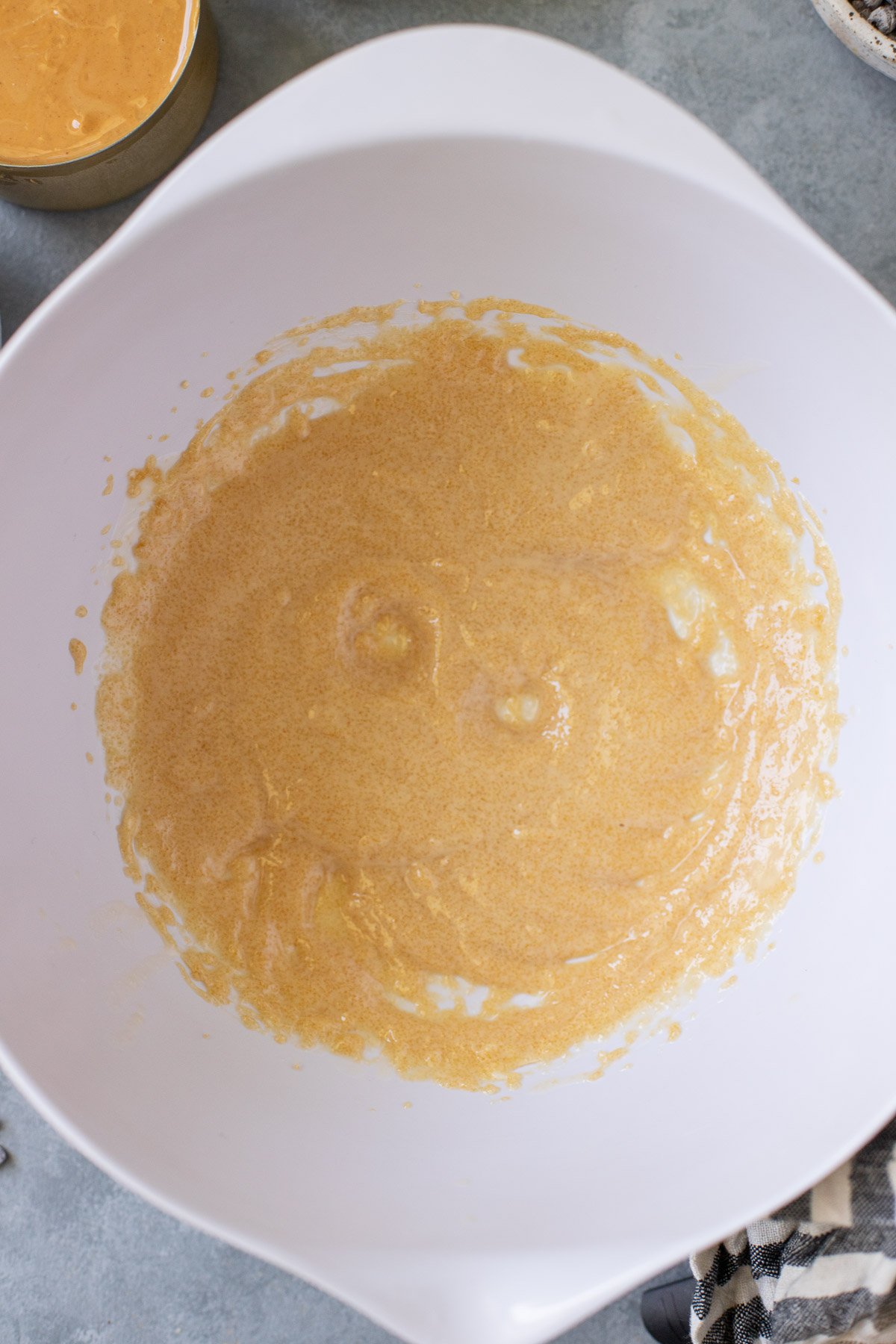 Creamed butter and brown sugar in a white bowl