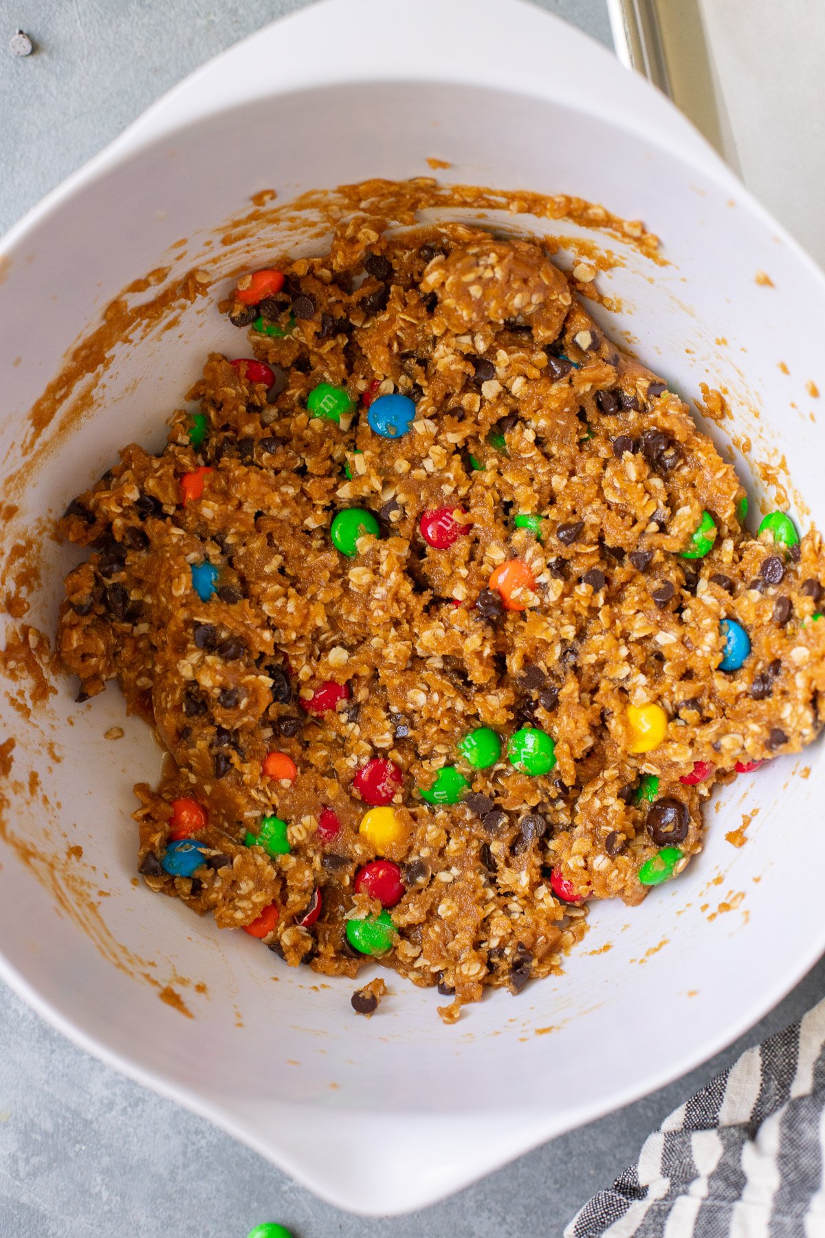 healthy monster cookie dough in a white bowl 