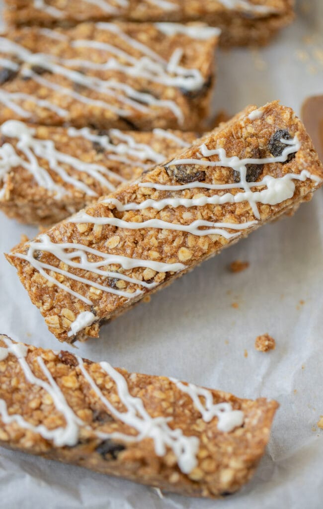 A close up of a healthy protein bar laying next to another protein bar