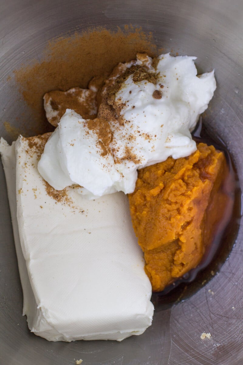 Mini pumpkin cheesecake filling in a bowl before mixing together.