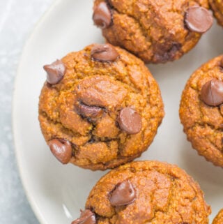 Healthy Pumpkin Muffins on a white plate with a blue linen off to the left corner