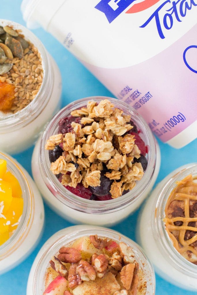 5 Healthy Yogurt Parfaits on a blue background.