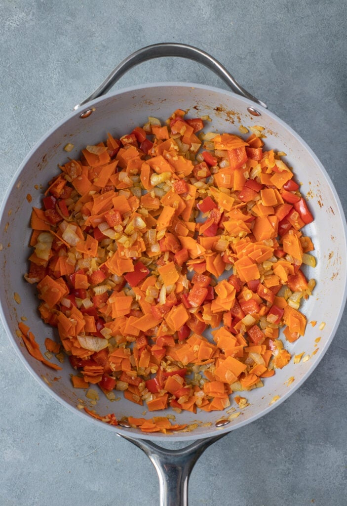 Veggies cooking in a pan for homemade fried rice