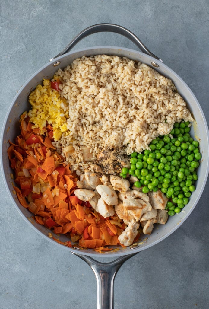 a big bowl of healthy fried rice before it has been stirred together