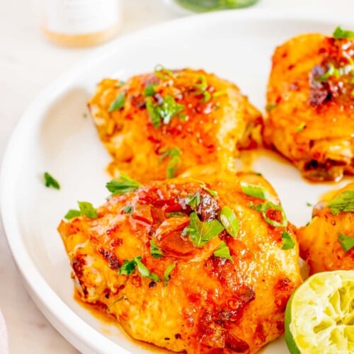 Honey Chipotle Chicken thighs on a white plate