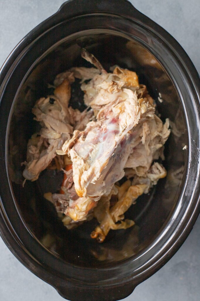 an overhead of bone broth bones in a crockpot 