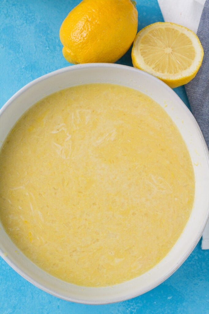 healthy lemon bar filling being mixed together in a white bowl