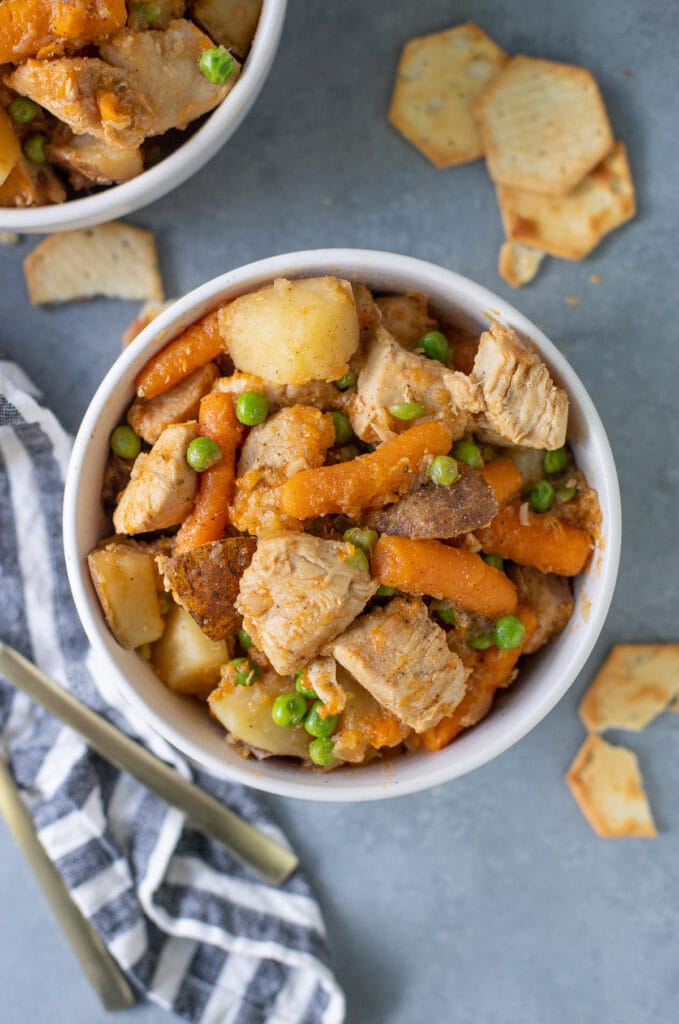 An overhead shot of instant pot chicken stew on a grey background