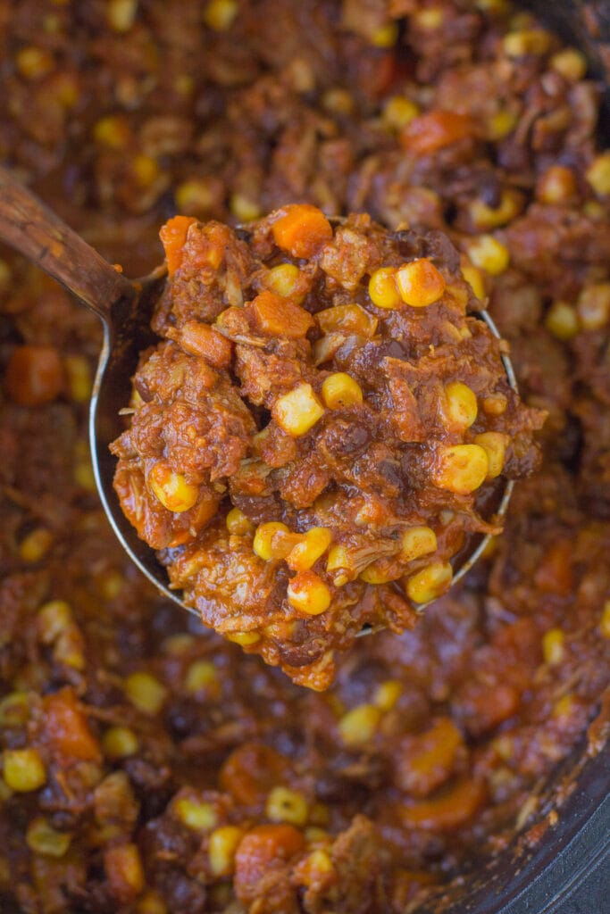 A ladle scooping up a serving of Leftover Turkey Chili