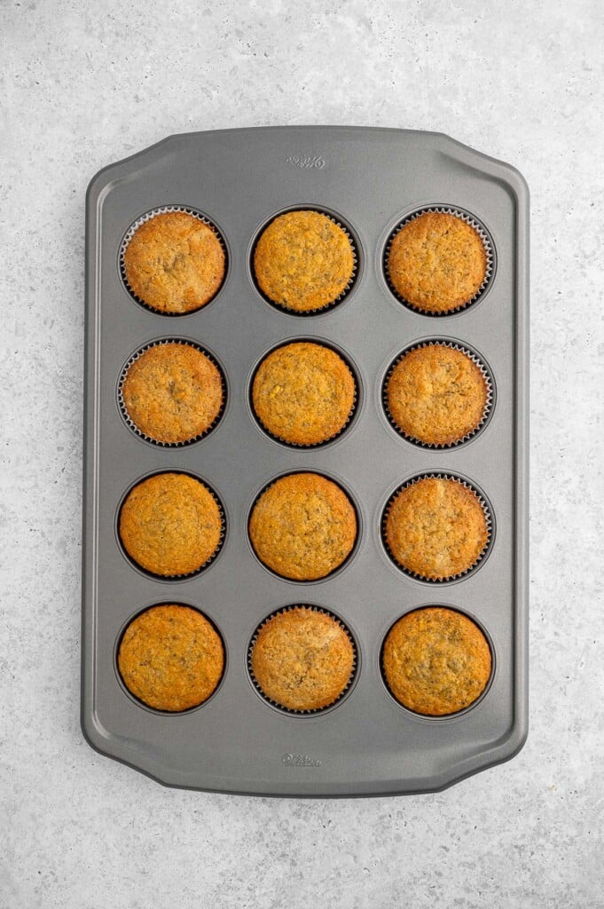 Cooked Lemon Chia Muffins still in the muffin pan. 