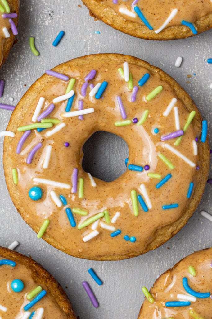 A hand holding up Clean Eating Protein Donuts