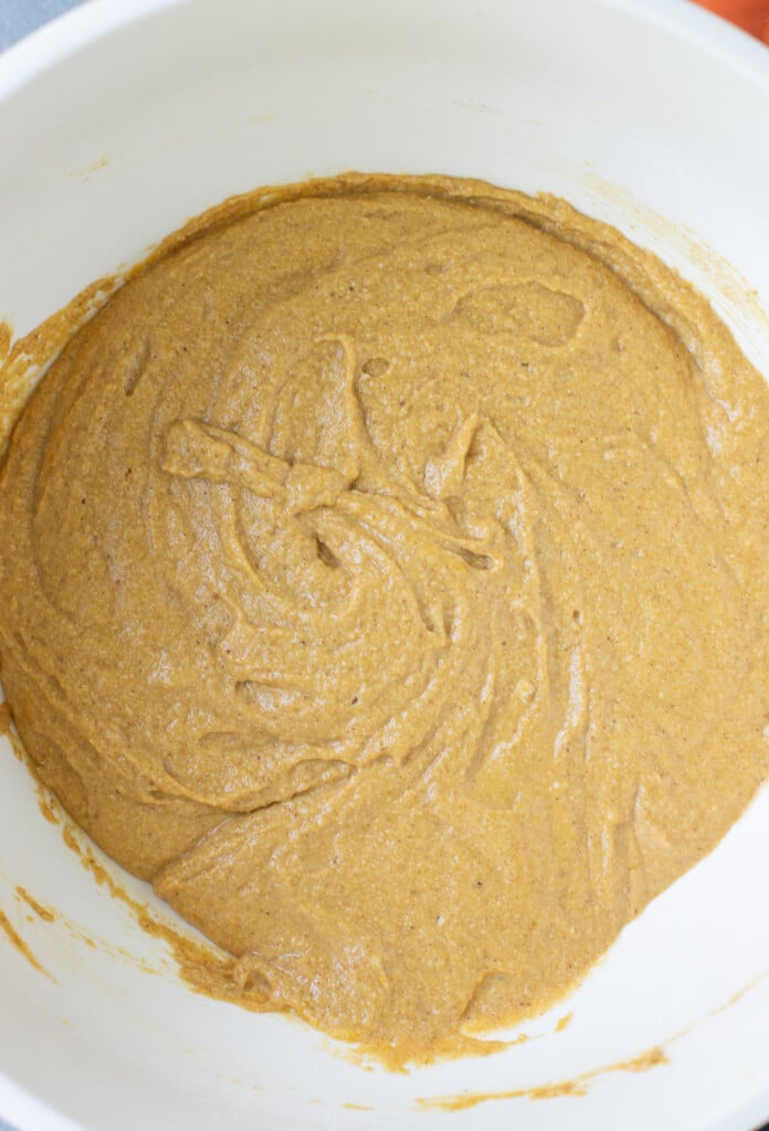 a close up of gluten free pumpkin muffin batter before being added to muffin tins