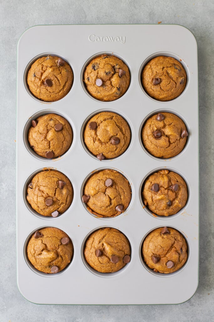 a close up of healthy pumpkin muffins fresh out of the oven