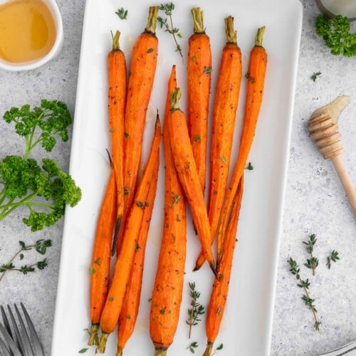 Honey Roasted Carrots on a white platter.