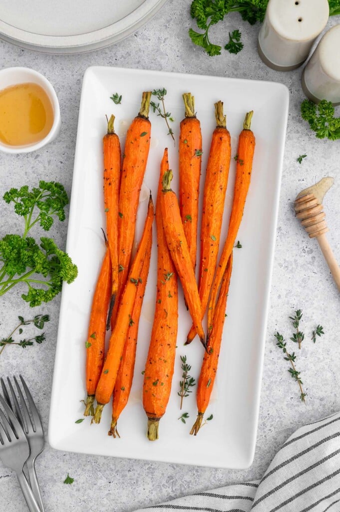Honey Roasted Carrots on a white platter.