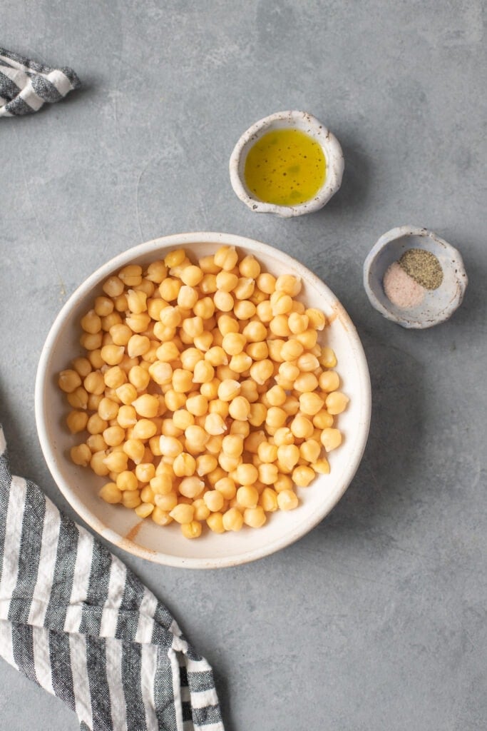 Roasted Garbanzo Beans Ingredients in small white bowls on a grey background