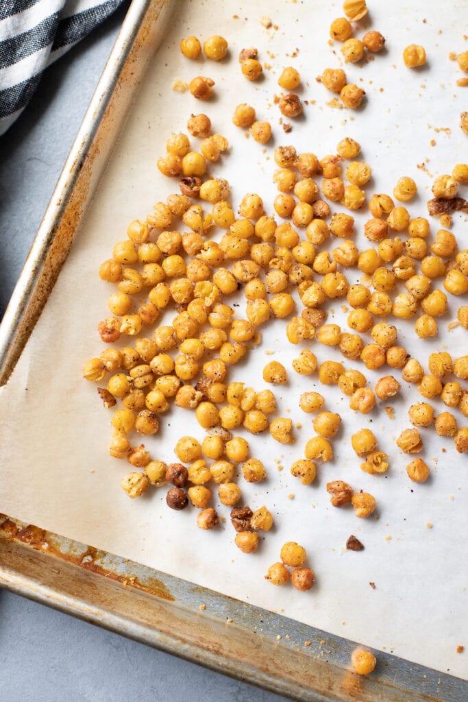 Roasted chickpeas on a baking sheet fresh out of the oven